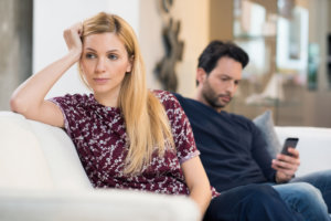 beginnings-treatment-centers-how-to-live-with-an-addict-post-man-and-woman-on-couch-after-argument