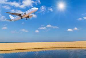 beginnings treatment image of plane landing over beach 541135675