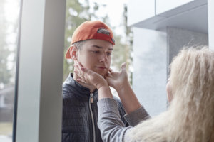 beginningstreatment-7-symptoms-of-codependency-photo-mother-and-son-relationships-concept-lifestyle-portrait-of-mature-blond-woman-wearing-hat-at-her-648193204