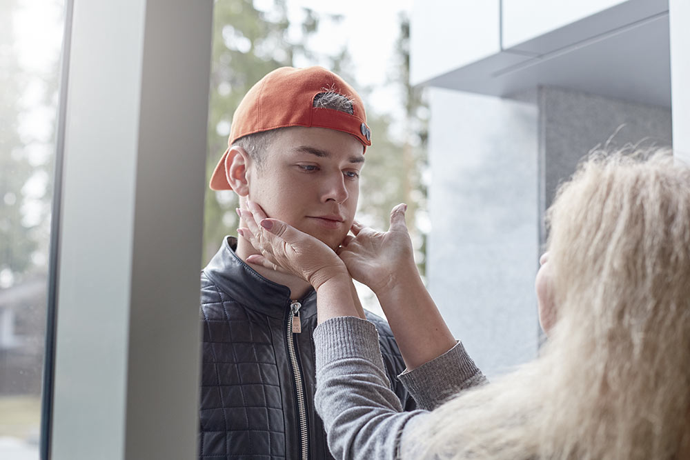 beginningstreatment-7-symptoms-of-codependency-photo-mother-and-son-relationships-concept-lifestyle-portrait-of-mature-blond-woman-wearing-hat-at-her-648193204