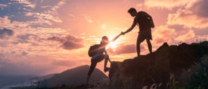 beginningstreatment-addiction-treatment-choices-for-myself-photo-people-helping-each-other-hike-up-a-mountain-at-sunrise-giving-a-helping-hand-and-active-fit-582394888