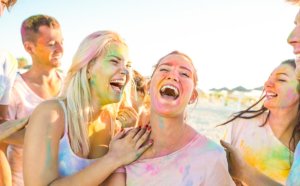 beginningstreatment-7-ways-to-have-summer-fun-without-using-article-photo-happy-friends-group-having-fun-at-beach-party-on-holi-festival-summer-vacation-young-people-666757777