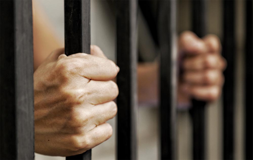 beginningstreatment-can-i-go-to-rehab-instead-of-jail-article-photo-hands-of-prisoner-holding-black-metal-bars-criminal-locked-in-jail-waiting-for-release-626843165