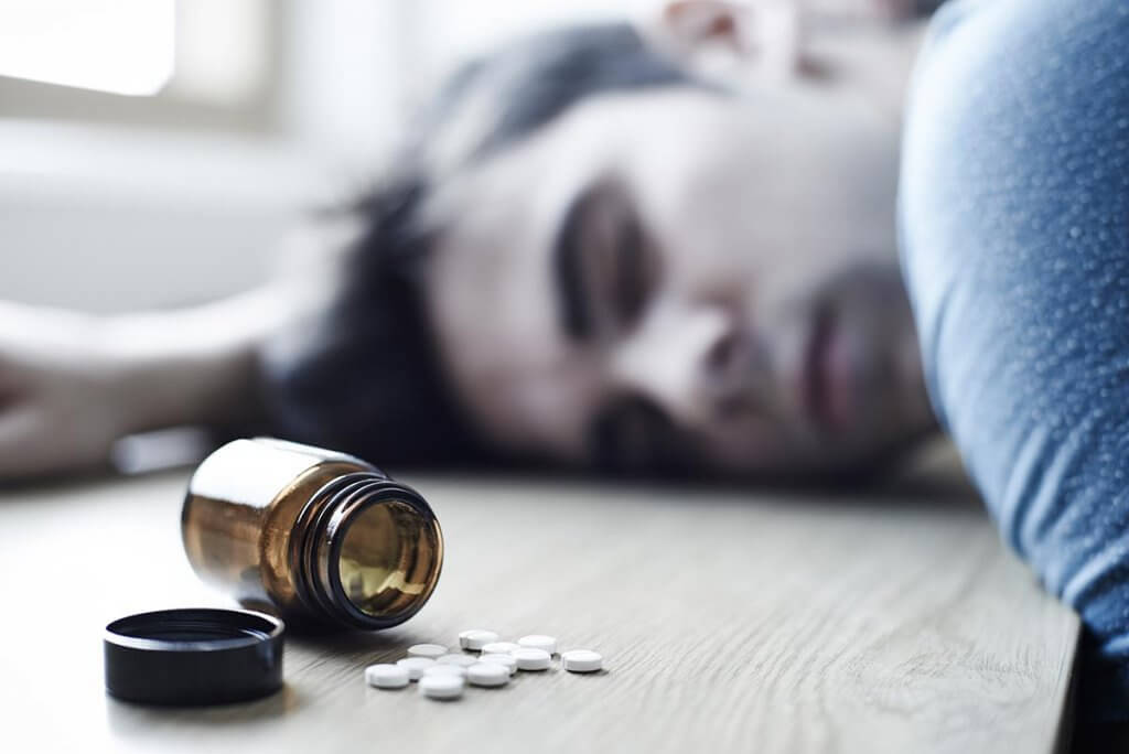 beginningstreatment-how-to-deal-with-the-grief-of-a-loved-ones-overdose-article-photo-young-man-overdosing-on-illegal-drugs-424836817