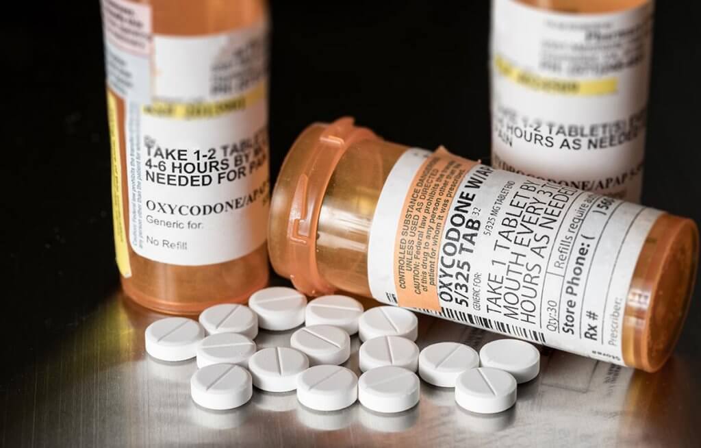 beginningstreatment-what-is-oxycontin-article-photo-oxycodone-is-the-generic-name-for-a-range-of-opoid-pain-killing-tablets-prescription-bottle-for-562612936
