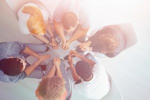 lagunatrailsrecovery-holistic-methods-to-treat-insomnia-in-recovery-article-photo-high-angle-of-young-people-sitting-in-a-circle-during-an-appointment-with-therapist-782629147