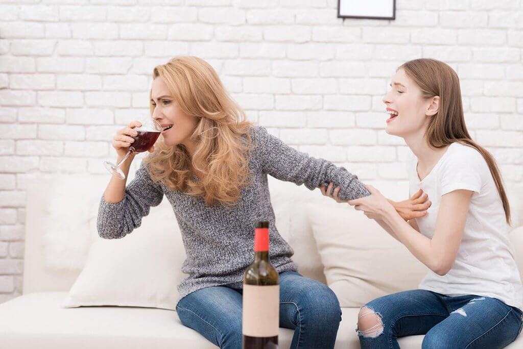 beginningstreatment-7-common-characteristics-of-adult-children-of-alcoholics-article-photo-a-teenage-daughter-tries-to-stop-her-mother-to-drink-772783516