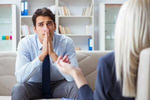 beginningstreatment-am-i-as-sick-as-my-secrets-article-photo-young-man-visiting-psychiatrist-doctor-for-consultation-793958992