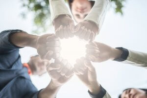 beginningstreatment-photo-hands-in-circle-as-symbol-of-their-partnership-and-teamwork-collaboration-concept-785445346