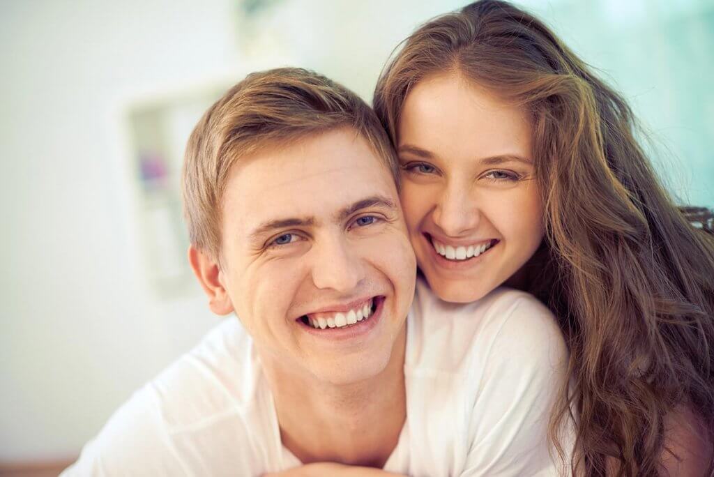 beginningstreatment-7-reasons-why-you-should-participate-in-your-loved-ones-treatment-article-photo-portrait-of-joyful-young-people-looking-at-camera-and-laughing-124551439