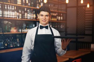 beginningstreatment-how-to-stay-in-recovery-if-you-work-around-alcohol-article-photo-male-waiter-holding-tray-in-cafe