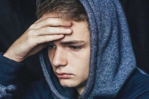 beginningstreatment-what-to-do-when-your-child-is-using-drugs-article-photo-portrait-of-a-sad-tired-depressed-teenager-problems-of-teenagers-concept