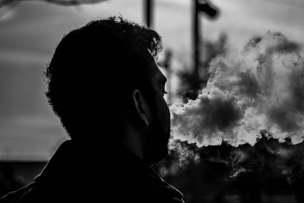 beginningstreatment-the-link-between-vaping-and-drug-addiction-photo-of-backlight-backlit-black-and-white