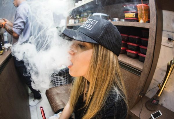 beginningstreatment-the-link-between-vaping-and-drug-addiction-photo-of-young-adult-lady-blur-cap-vaping