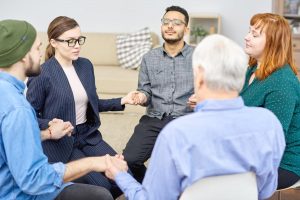 beginningstreatment-How to Get the Courage to Share at a 12 Step Meeting photo of a group-therapy-session
