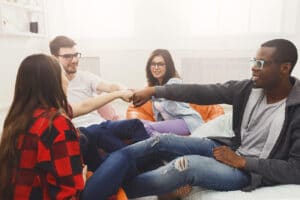 Small group of people all talking together and motivating each other to stop using Xanax