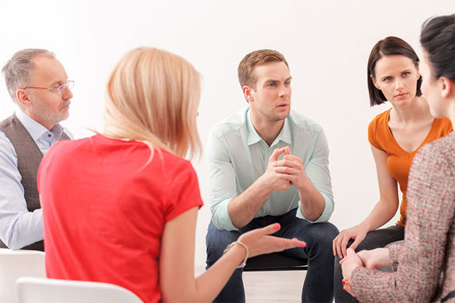 Group of people talking in their support group