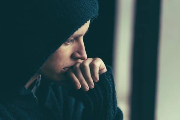 Person in deep thought about going to rehab
