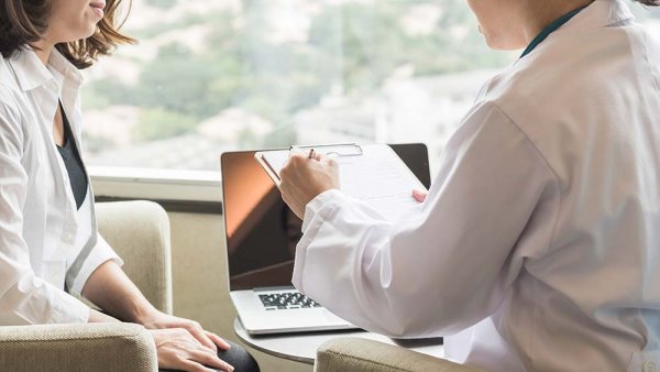 Doctor going over test results with patient