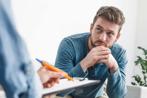 Man during therapy with a psychologist