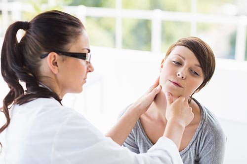 doctor conducting a physical assessment of a patient during addiction treatment