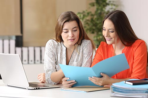 Woman and her doctor going over a customized treatment plan in addiction treatment